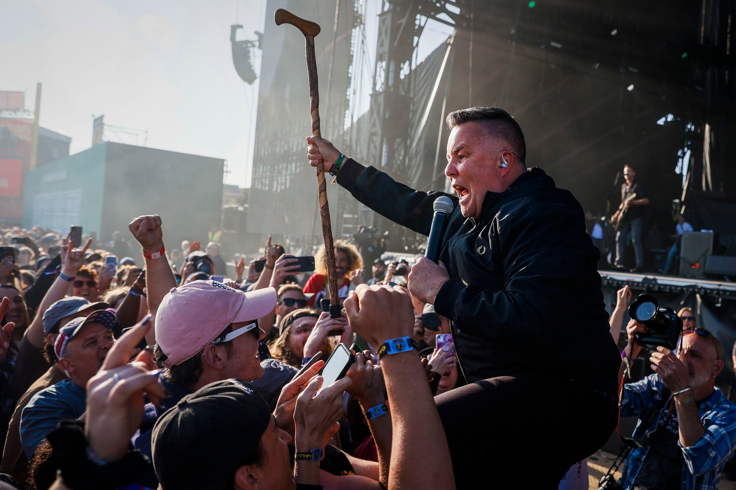 Ken Casey of the Dropkick Murphys wades into the crowd at Boston Calling 2023 on Friday.