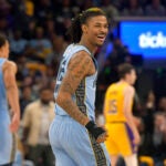 Memphis Grizzlies guard Ja Morant (12) reacts during the second half of Game 5 of the team's first-round NBA basketball playoff series against the Los Angeles Lakers