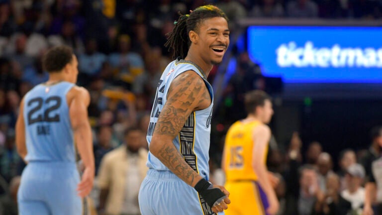 Memphis Grizzlies guard Ja Morant (12) reacts during the second half of Game 5 of the team's first-round NBA basketball playoff series against the Los Angeles Lakers