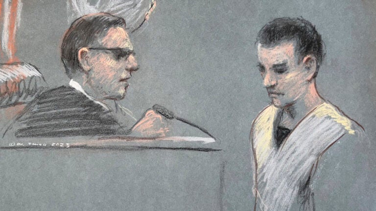 This artist depiction shows Massachusetts Air National Guardsman Jack Teixeira, right, appearing in U.S. District Court in Boston.