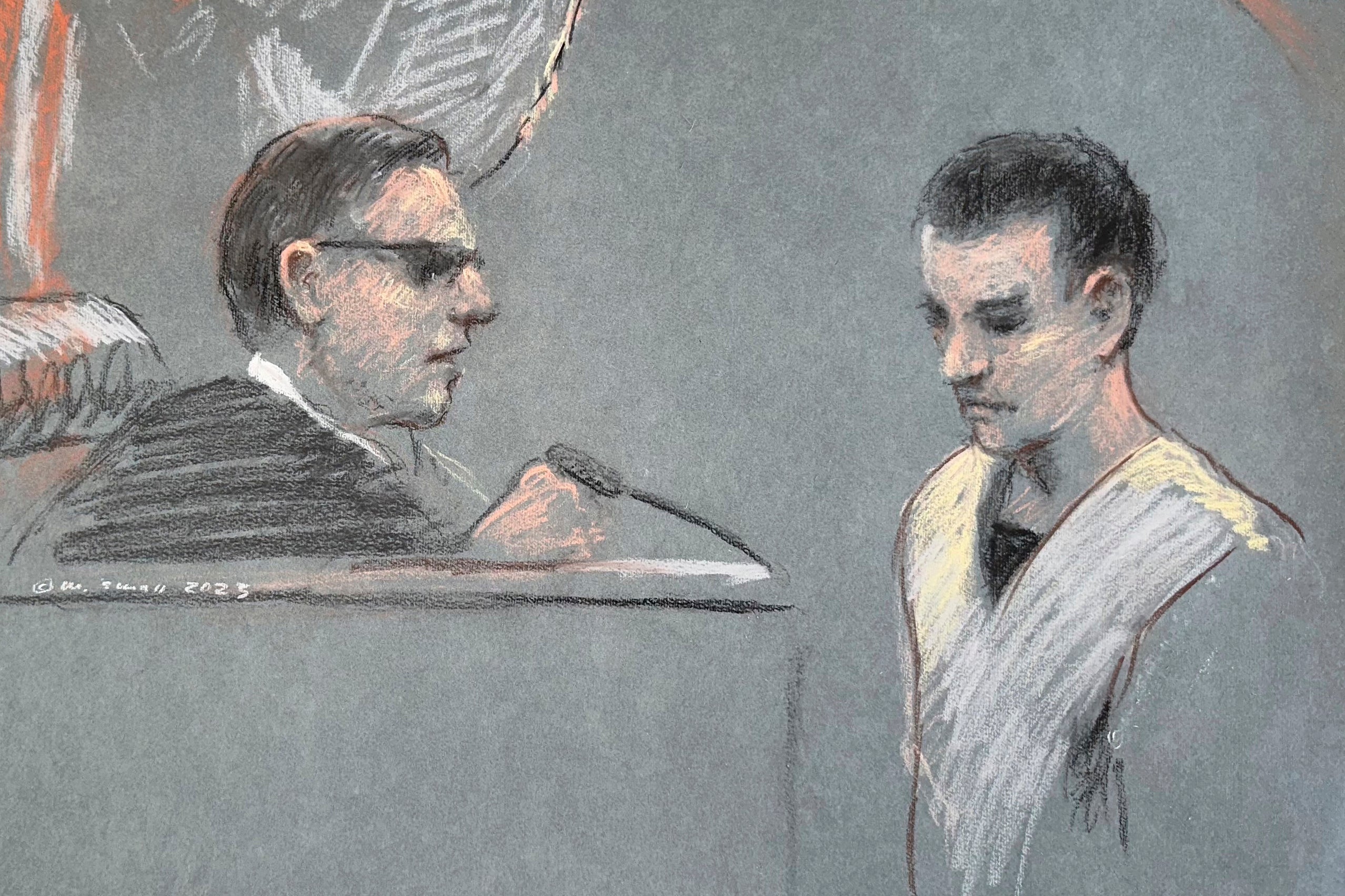 This artist depiction shows Massachusetts Air National Guardsman Jack Teixeira, right, appearing in U.S. District Court in Boston.