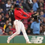 Boston Red Sox Pablo Reyes hits a two-run double in the first inning of the team's baseball game against the Seattle Mariners, Wednesday, May 17, 2023, in Boston. (AP Photo/Steven Senne)