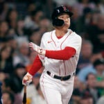 Boston Red Sox Masataka Yoshida watches the flight of his RBI double in the fifth inning