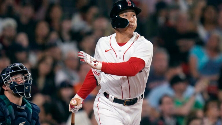 Boston Red Sox Masataka Yoshida watches the flight of his RBI double in the fifth inning