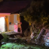 A damaged car that drove through a Marlborough home