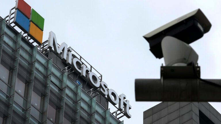A security surveillance camera is seen near the Microsoft office building in Beijing, July 20, 2021.