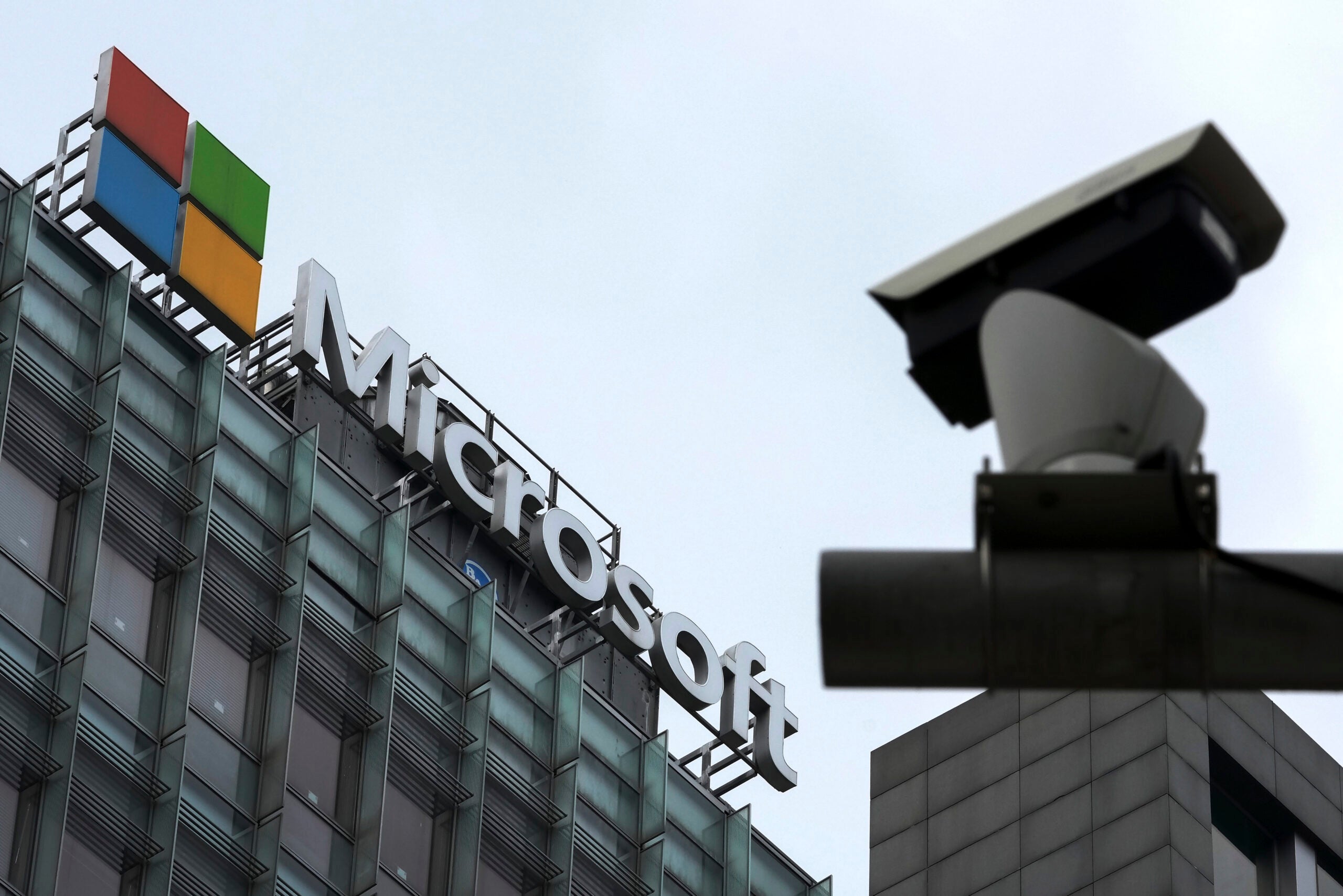 A security surveillance camera is seen near the Microsoft office building in Beijing, July 20, 2021.