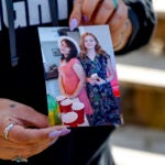 Ashleigh Webster shows a photo of Ivy Webster and Tiffany Guess at her home in Henryetta, Okla., Tuesday, May 2, 2023.