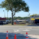Police vehicles sit parked in front of a McDonald's restaurant as police investigate a shooting in which multiple people were killed Thursday, May 4, 2023, in Moultrie, Ga.