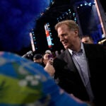 NFL Commissioner Roger Goodell meets with fans during the first round of the 2023 NFL Draft.