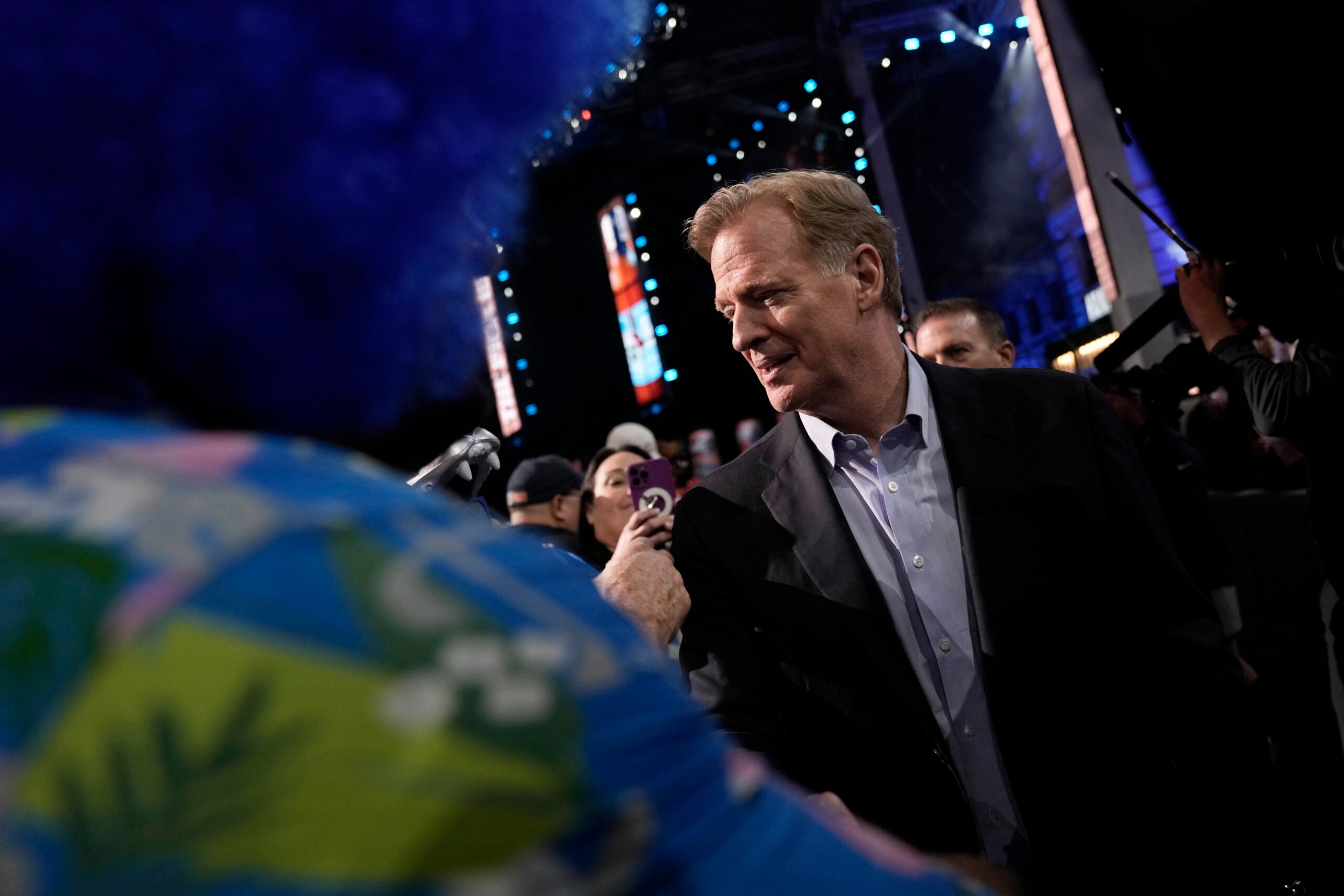 NFL Commissioner Roger Goodell meets with fans during the first round of the 2023 NFL Draft.