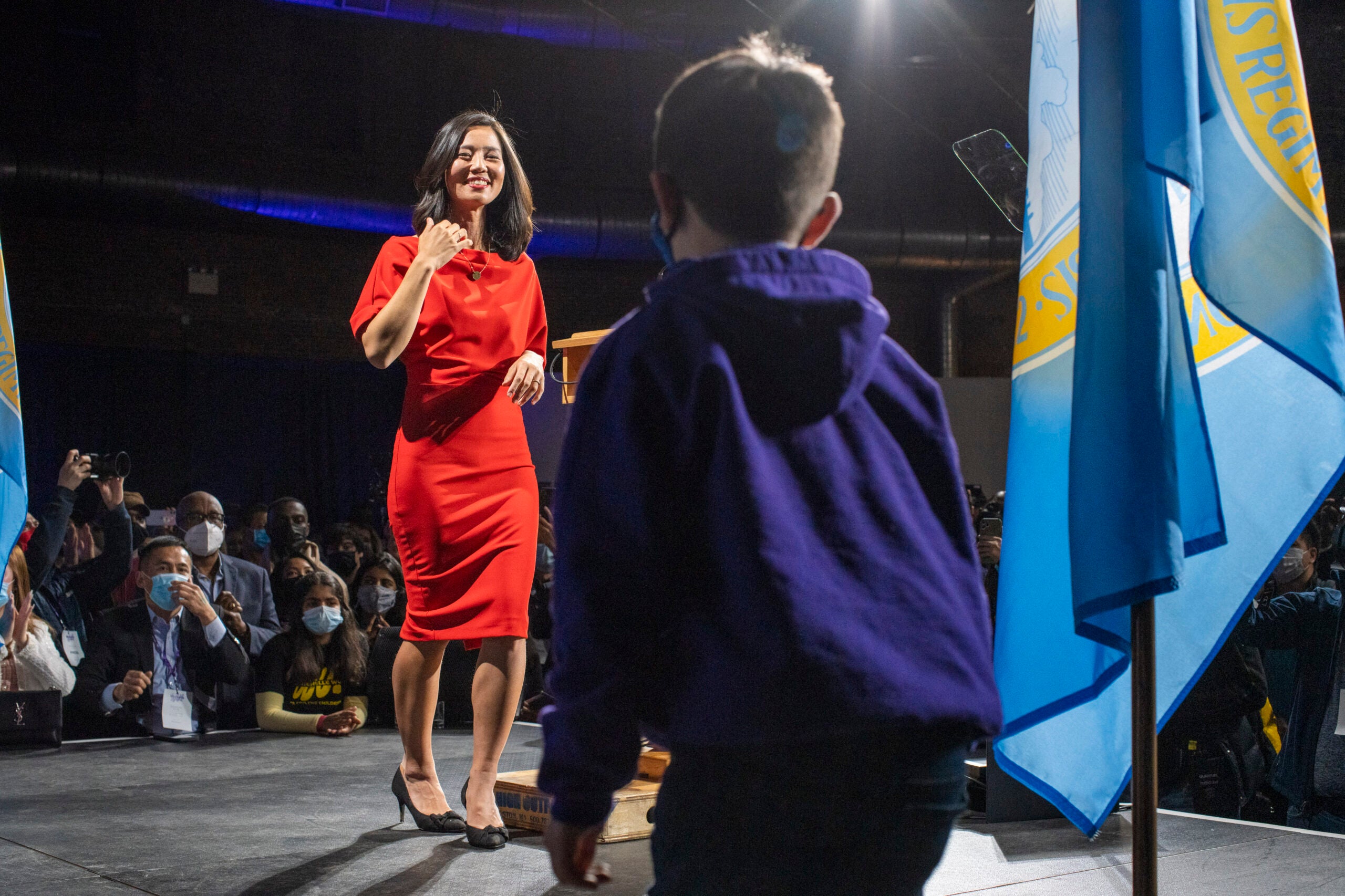 Michelle Wu greets her son after declaring victory in Boston’s mayoral race, on Election Night in Boston in 2021.