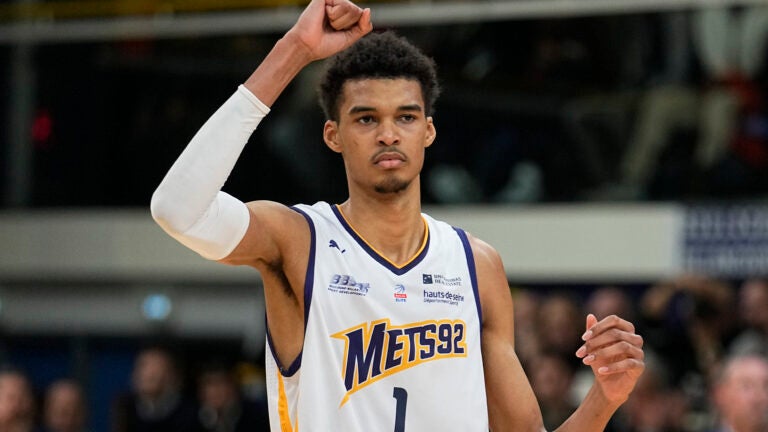 Boulogne-Levallois' Victor Wembanyama celebrates after a dunk against Lyon-Villeurbanne during a basketball game in Levallois, France