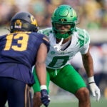 Oregon defensive back Christian Gonzalez (0) covers California safety Miles Williams (13) during a punt in the second half of an NCAA college football game in Berkeley, Calif., Saturday, Oct. 29, 2022.