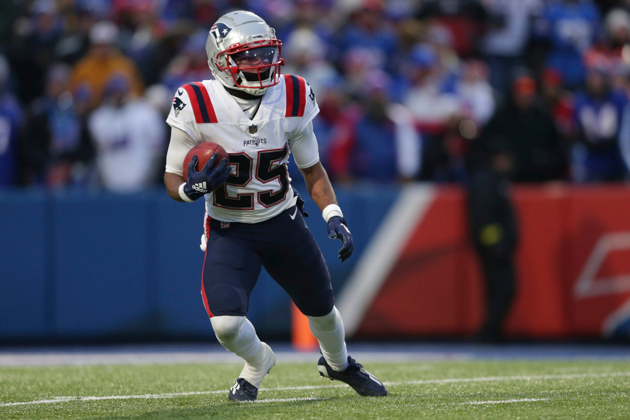 New England Patriots cornerback Marcus Jones (25) returns a kickoff during the second half of an NFL football game against the Buffalo Bills.