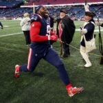 Matthew Judon #9 of the New England Patriots runs off the field after defeating the New York Jets at Gillette Stadium on November 20, 2022 in Foxborough, Massachusetts.