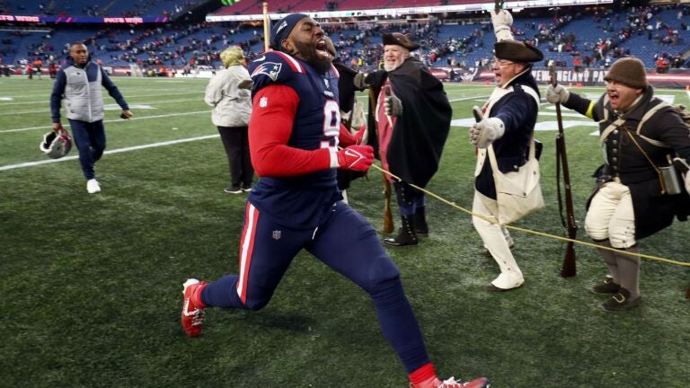Matthew Judon #9 of the New England Patriots runs off the field after defeating the New York Jets at Gillette Stadium on November 20, 2022 in Foxborough, Massachusetts.