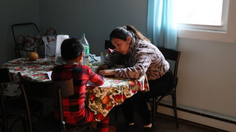 Vicky, who arrived recently from Peru, helped her son with his English homework inside the family’s rented two-bedroom apartment in Chelsea.