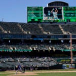 Texas Rangers pitcher Jon Gray (22) throws to an Oakland Athletics batter during the eighth inning of a baseball game in Oakland.