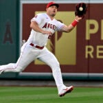 Los Angeles Angels center fielder Mike Trout runs to catch a fly ball hit by Boston Red Sox's Pablo Reyes during the fifth inning.