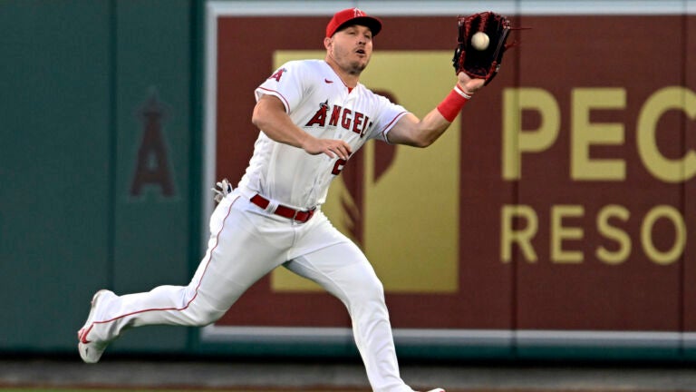 Los Angeles Angels center fielder Mike Trout runs to catch a fly ball hit by Boston Red Sox's Pablo Reyes during the fifth inning.