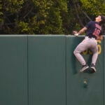 Red Sox center fielder Jarren Duran watches as a home run ball hit by the Angels' Mickey Moniak flies over the fence during the first inning.