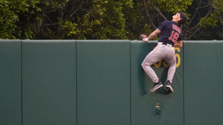 Red Sox center fielder Jarren Duran watches as a home run ball hit by the Angels' Mickey Moniak flies over the fence during the first inning.