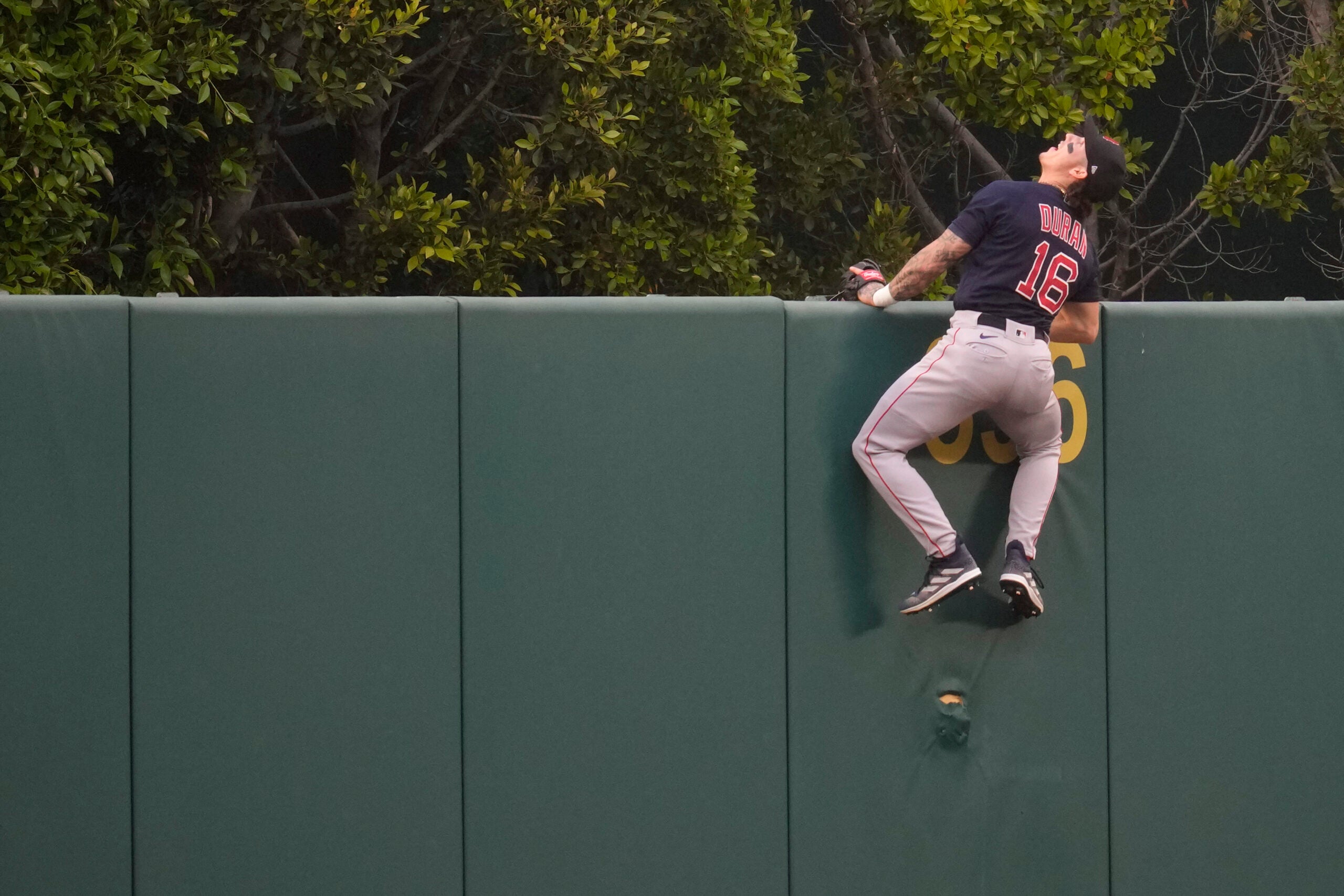 Red Sox center fielder Jarren Duran watches as a home run ball hit by the Angels' Mickey Moniak flies over the fence during the first inning.