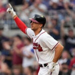 Braves first baseman Matt Olson gestures as he rounds the bases after hitting a home run in the first inning.