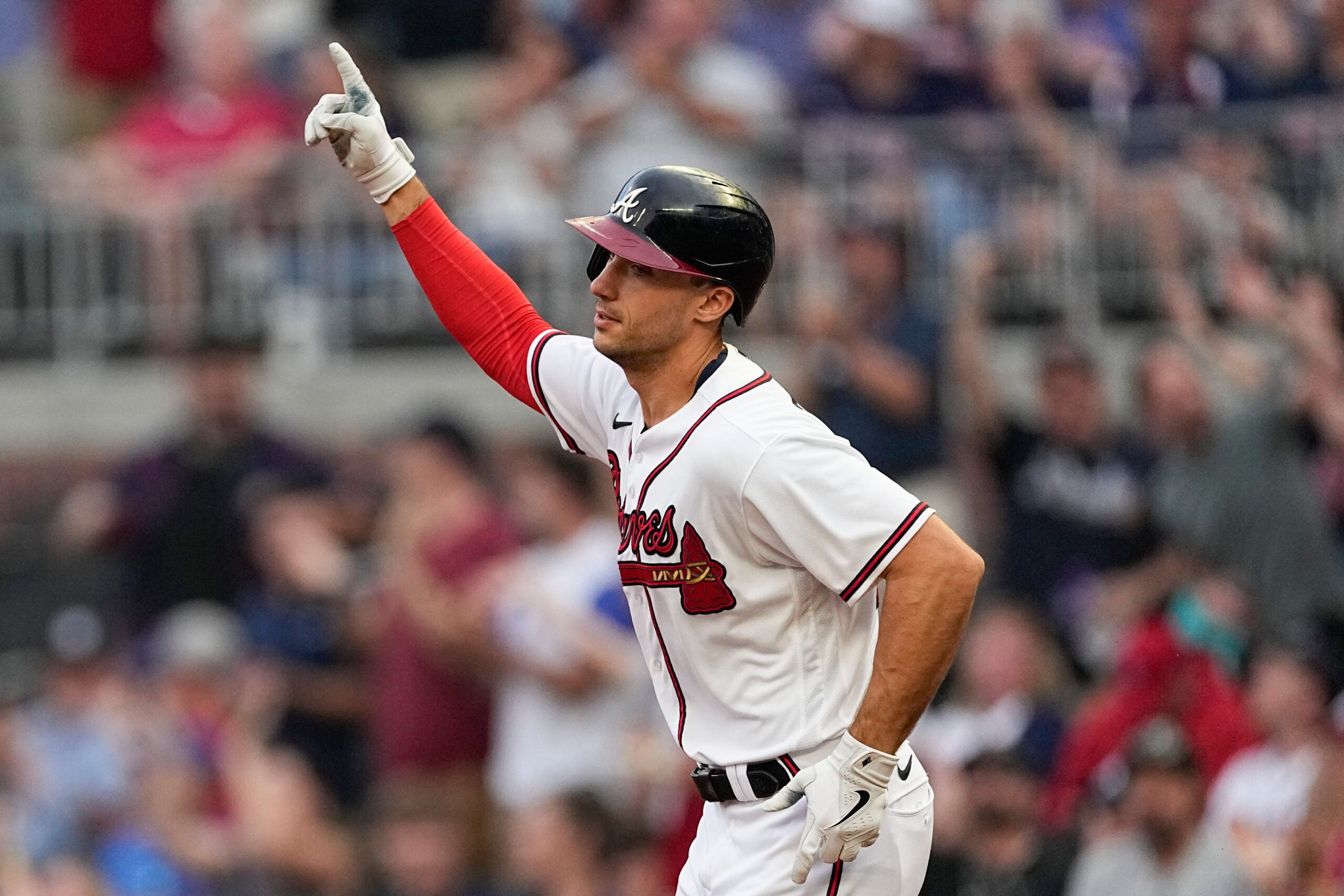 Braves first baseman Matt Olson gestures as he rounds the bases after hitting a home run in the first inning.