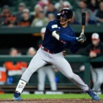 Red Sox outfielder Jarren Duran takes a swing in a game against the Orioles.