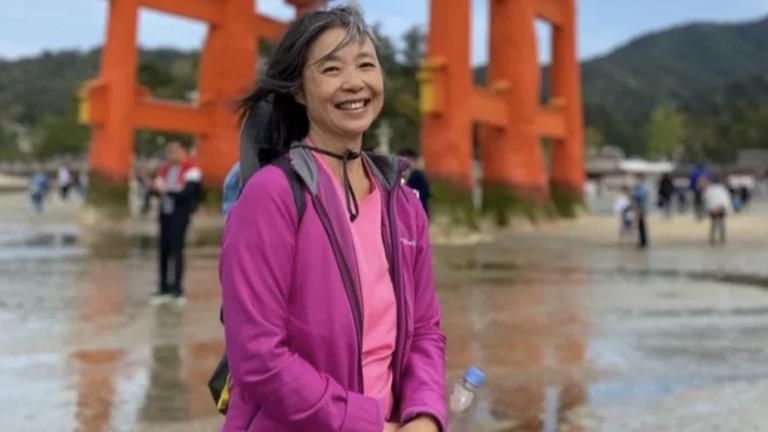 Patricia Wu-Murad in a pink shirt and pink jacket.