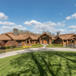 Mansion in the Berkshires with wood exterior.