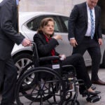 FILE - Sen. Dianne Feinstein, D-Calif., is assisted to a wheelchair by staff as she returns to the Senate after a more than two-month absence