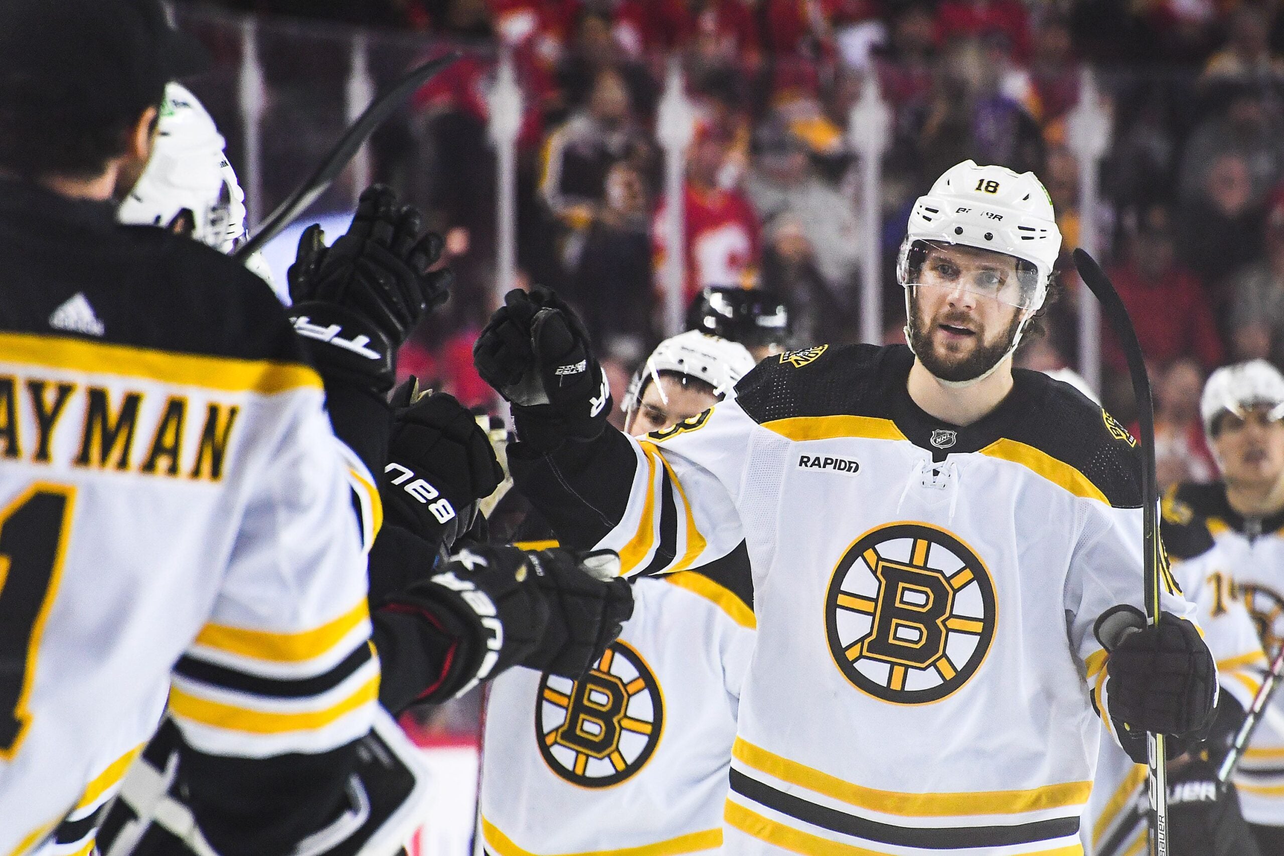 Pavel Zacha #18 of the Boston Bruins celebrates with his team after scoring in the third period forcing overtime against the Calgary Flames during an NHL game at Scotiabank Saddledome on February 28, 2023 in Calgary, Alberta, Canada.