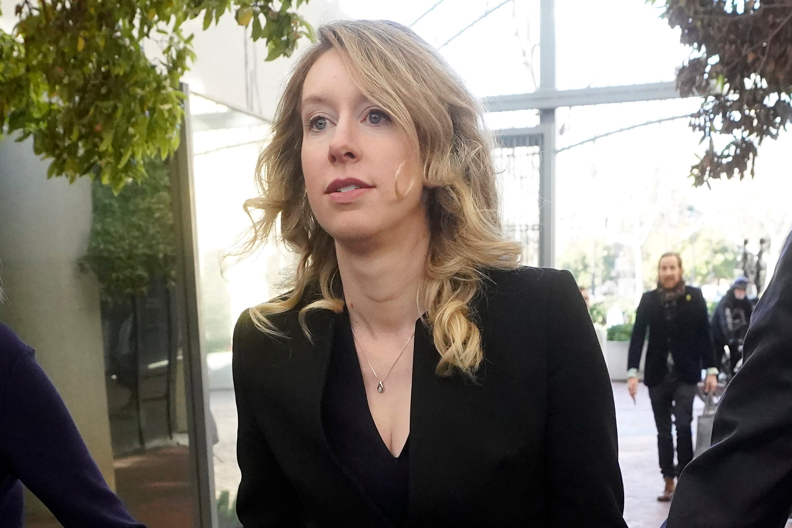 Former Theranos CEO Elizabeth Holmes arrives at federal court in San Jose, Calif., March 17, 2023.