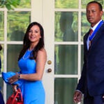 Tiger Woods, right, with his daughter Sam Alexis Woods, left, and his girlfriend Erica Herman, center, walk along the Colonnade following a ceremony where President Donald Trump awarded the Presidential Medal of Freedom to Tiger Woods at the White House in Washington, on May 6, 2019.