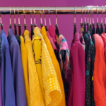 A rack of colorful vintage clothing.