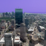 The skyline of Boston. The sky is tinted purple