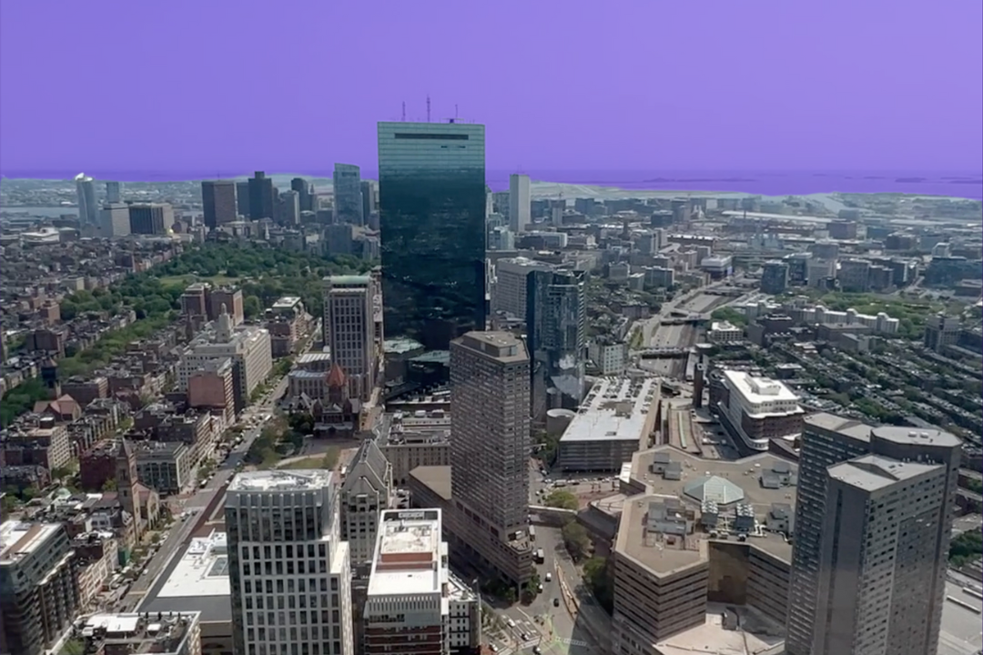 The skyline of Boston. The sky is tinted purple