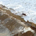 Waves crash into an eroded Salisbury Beach