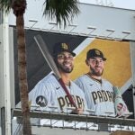 Xander Bogaerts, smiling on a San Diego Padres billboard.