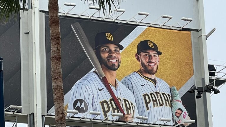 Xander Bogaerts, smiling on a San Diego Padres billboard.