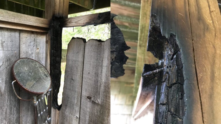 Two images of a damaged outdoor shower believed to have been caused by a mirror.