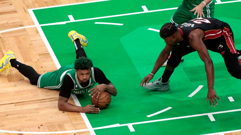 Celtics guard Marcus Smart (36) dives on a loose ball during the first quarter. The Boston Celtics host the Miami Heat in Game 5 of the NBA Eastern Conference Finals on May 25, 2023 at TD Garden in Boston, MA.