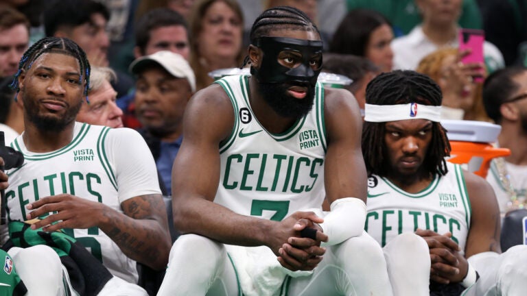 Boston, MA: Celtics starters (left to right) Marcus Smart, Jaylen Brown and Robert Williams are pictured on the bench in the thirde quarter. The Boston Celtics hosted the Miami Heat for Game One of their NBA Eastern Conferencene Finals series at the TD Garden.