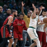 The Heat bench erupts and the Celtics Jayson Tatum reacts after he was whistled for a travelling violation with 1:27 left in the game. Miami head coach Erik Spoelstra is at far left. The Boston Celtics hosted the Miami Heat for Game One of their NBA Eastern Conferencene Finals series at the TD Garden.