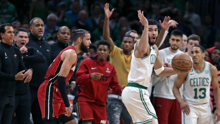 The Heat bench erupts and the Celtics Jayson Tatum reacts after he was whistled for a travelling violation with 1:27 left in the game. Miami head coach Erik Spoelstra is at far left. The Boston Celtics hosted the Miami Heat for Game One of their NBA Eastern Conferencene Finals series at the TD Garden.