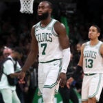 The Celtics Jaylen Brown (7) and Malcolm Brogdon (13) head off the court after the final horn sounded in Boston's loss.The Boston Celtics hosted the Miami Heat for Game Two of their NBA Eastern ConferenceFinals series at the TD Garden.