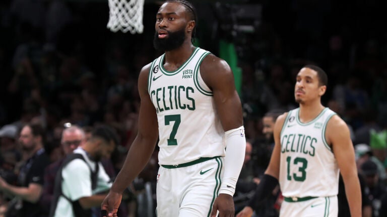 The Celtics Jaylen Brown (7) and Malcolm Brogdon (13) head off the court after the final horn sounded in Boston's loss.The Boston Celtics hosted the Miami Heat for Game Two of their NBA Eastern ConferenceFinals series at the TD Garden.